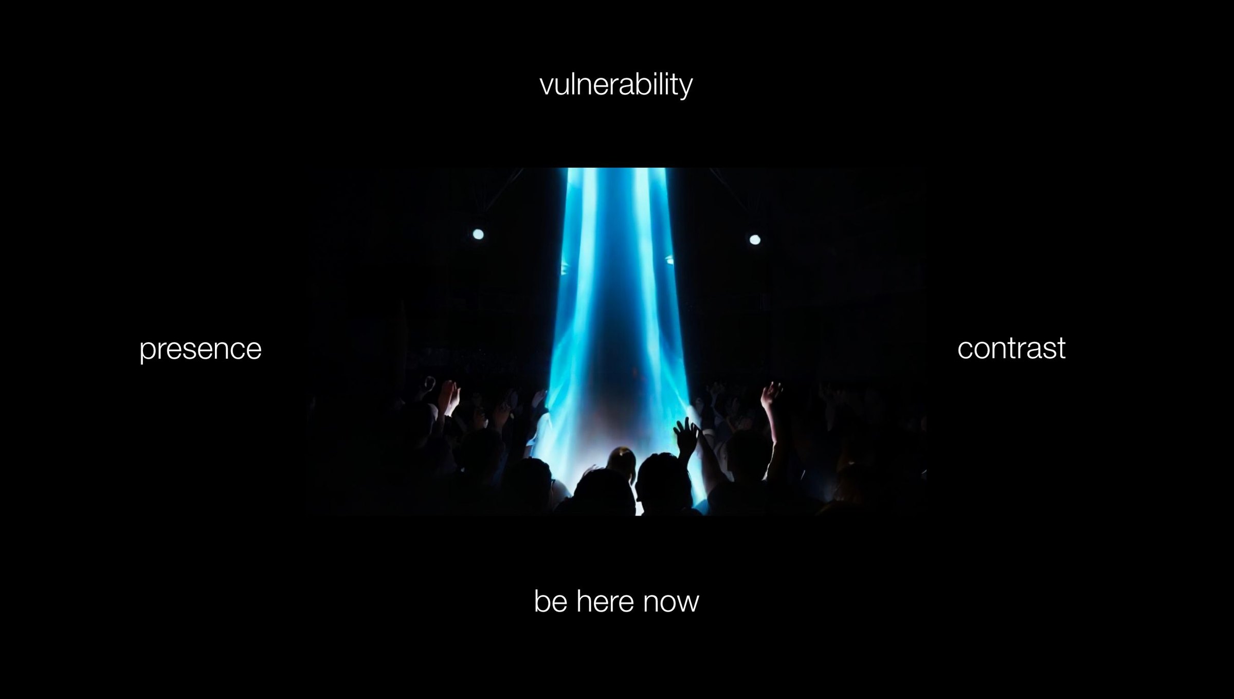 Slide from the NN pitch deck: a laser beacon over a crowd, surrounded by the words vulnerability, presence, contrast, be here now